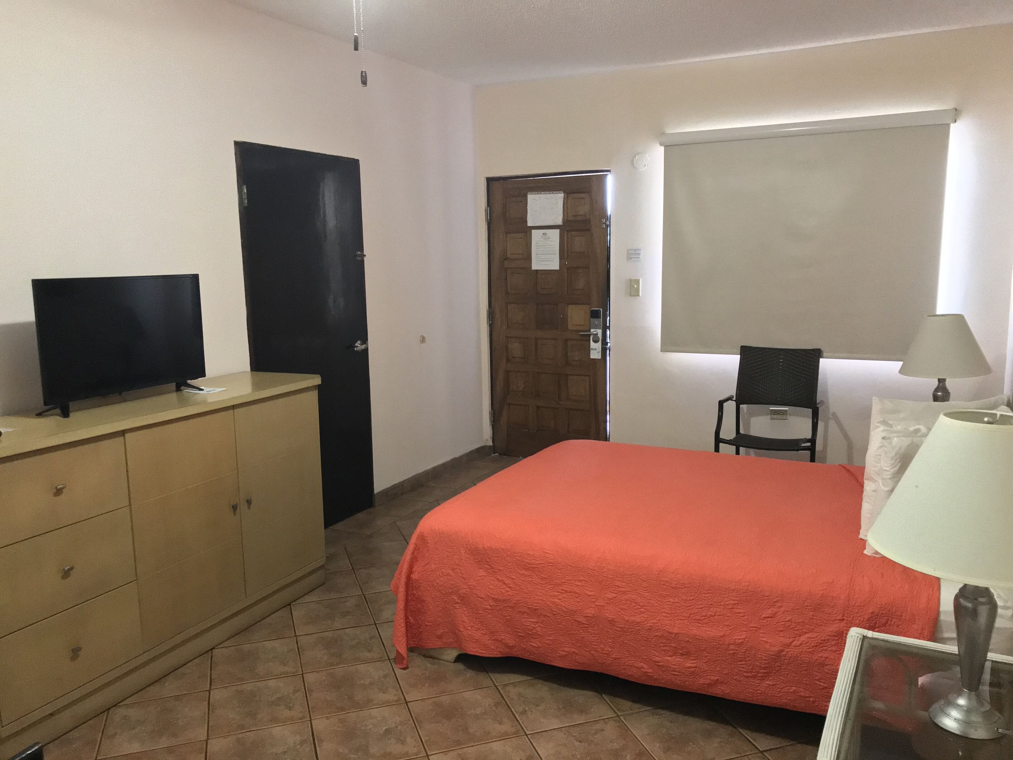 economy room, 1 queen bed, accessible, non smoking (ground floor) | 1 bedroom, blackout curtains, iron/ironing board, free wifi