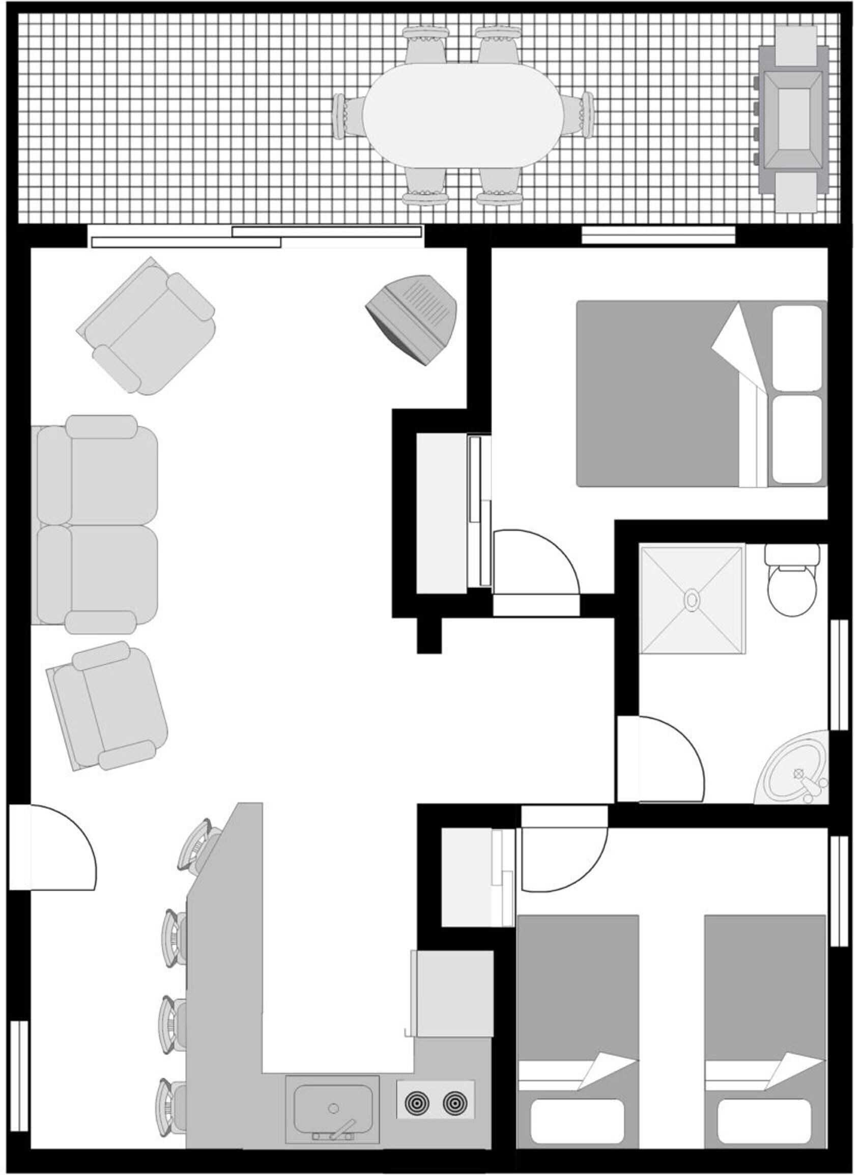 A floor plan of a hotel room with a bed, a desk, a chair, a small table, and a bathroom.