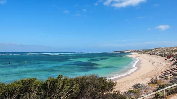 A coastal beach with clear turquoise waters, sandy shore, and rocky outcrops. - “ROCKPOOL” Holiday Beach House Margaret River (5 bedrooms,  walk to beach) (Gnarabup)