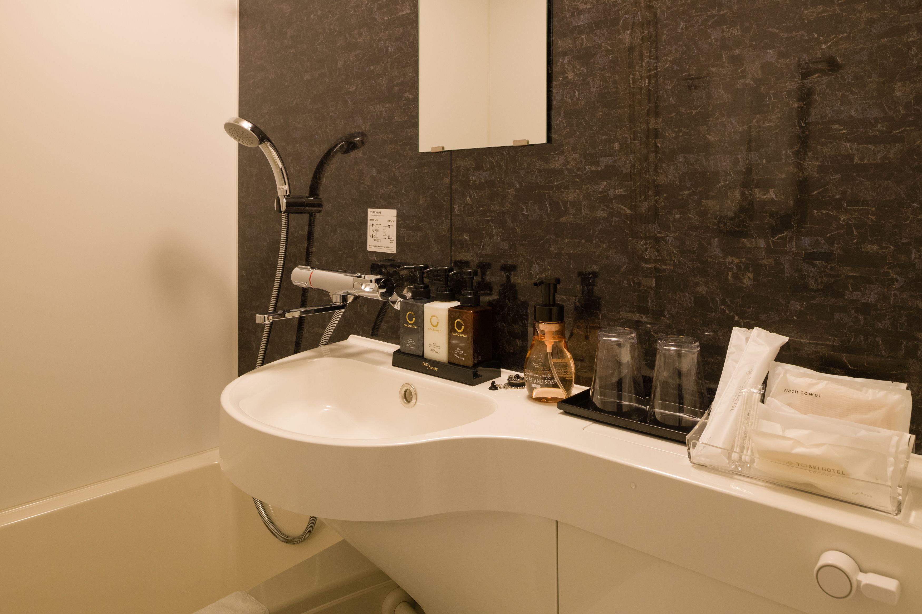 combined shower/bathtub, free toiletries, hair dryer, slippers