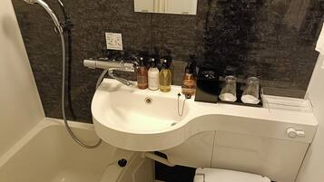 Combined shower/tub, free toiletries, hair dryer, slippers