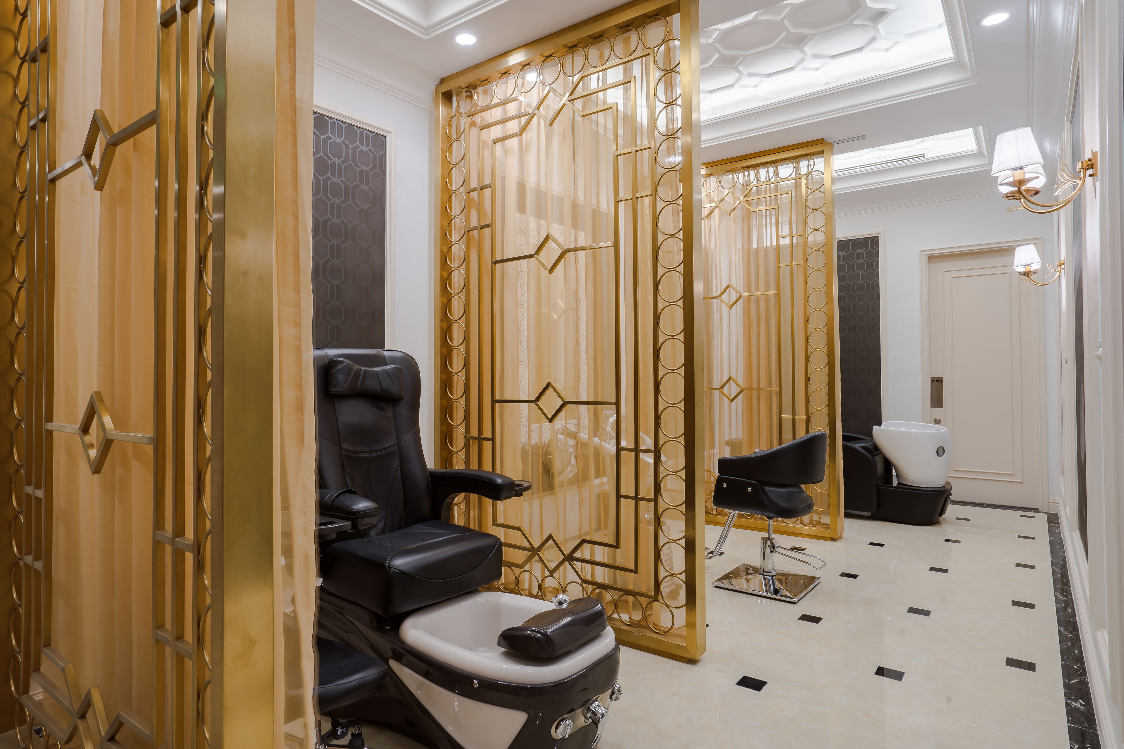 A modern bathroom with a black massage chair, a white toilet, and a shower area.