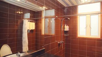 Shower, free toiletries, slippers, towels