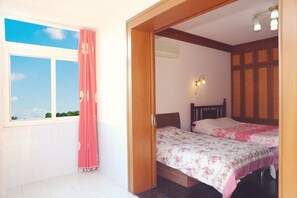 Comfort Family Room with Shared Bathroom | Blackout drapes, free WiFi, bed sheets