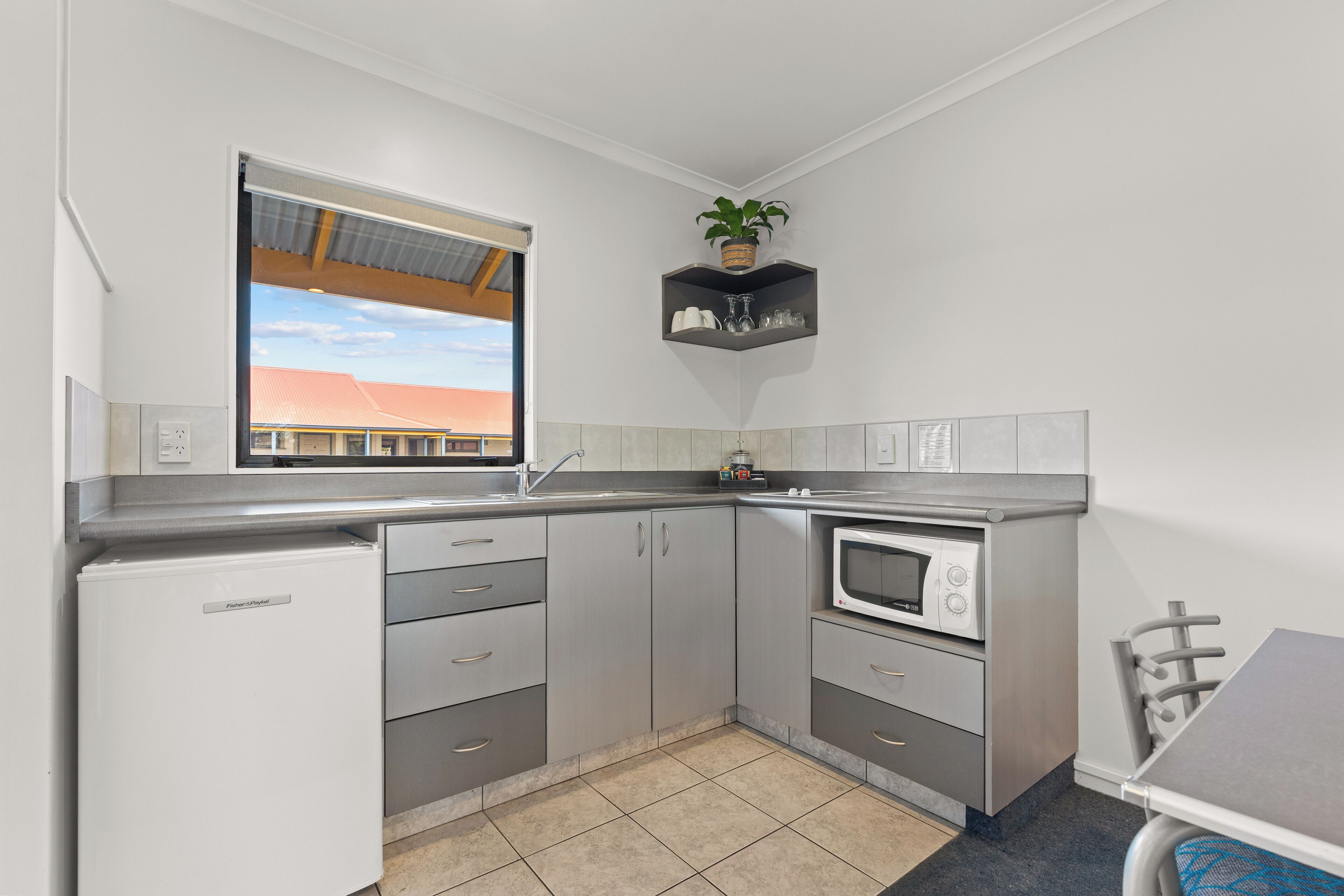 One Bedroom Two Queens | Private kitchen | Microwave, stovetop, coffee/tea maker, electric kettle