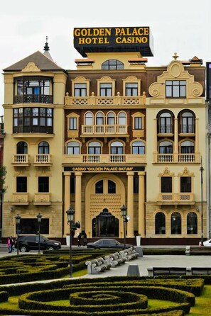 A large, ornate building with a sign reading "Golden Palace Hotel Casino." - Golden Palace Batumi Hotel & Casino (Batumi)