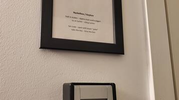 A framed number '101' with instructions for a keybox and a keypad device below it.