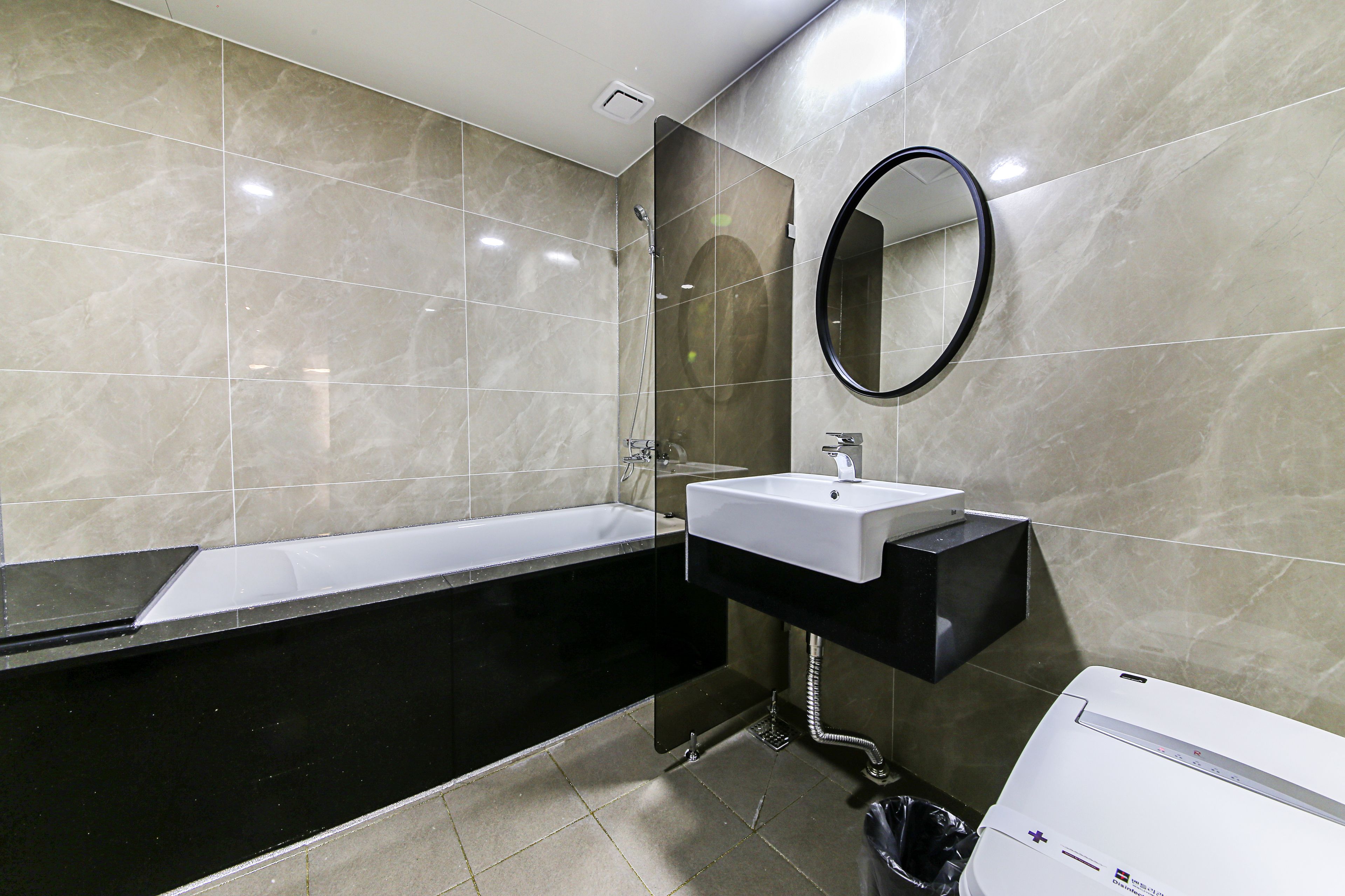 junior suite | bathroom | shower, free toiletries, hair dryer, bathrobes