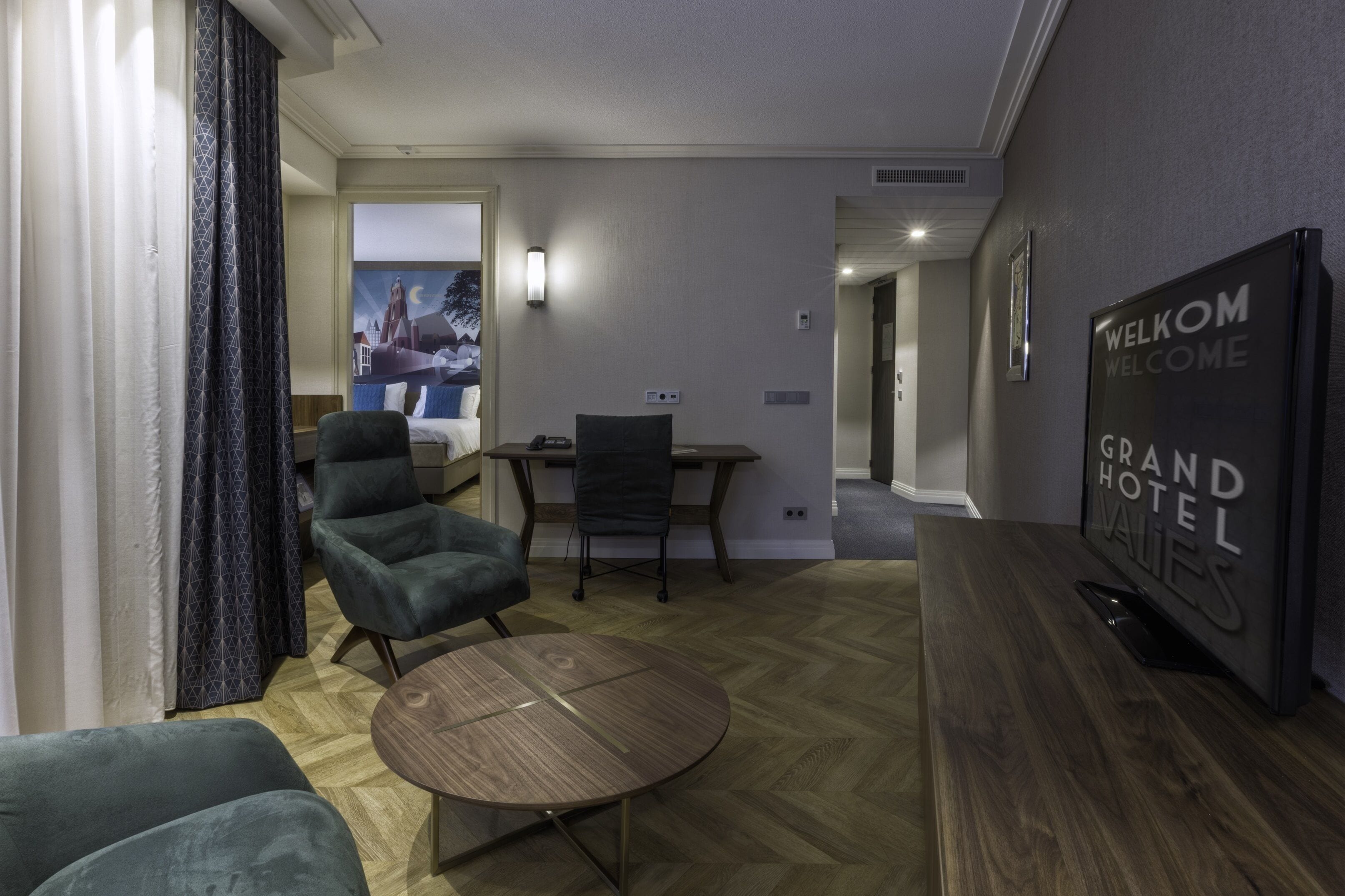 executive suite | living room | 43-inch flat-screen tv with satellite channels, tv, heated floors