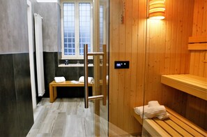A modern bathroom with a wooden sauna, a glass shower enclosure, and a window with a view. - Hermes Rooms for tourists (Naples)