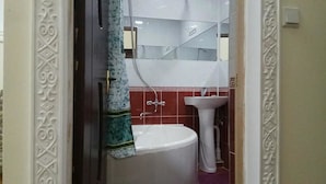 A bathroom with a toilet, sink, and mirror. - Hotel Abu Shakheen (Bukhara)
