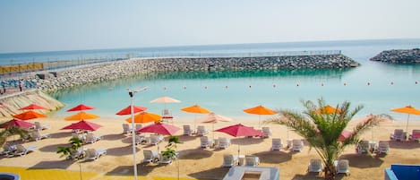 Private beach, beach umbrellas, beach towels, water skiing