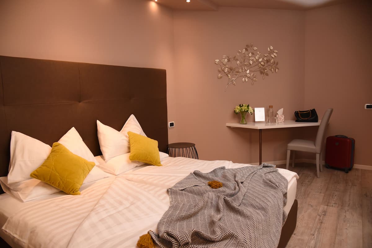Deluxe Quadruple Room, Balcony | In-room safe, desk, free WiFi, wheelchair access