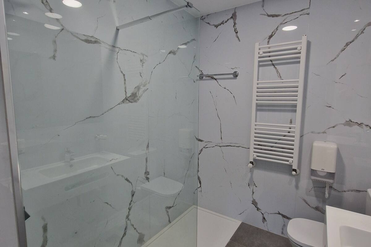 comfort room | bathroom | hair dryer, towels, soap, shampoo