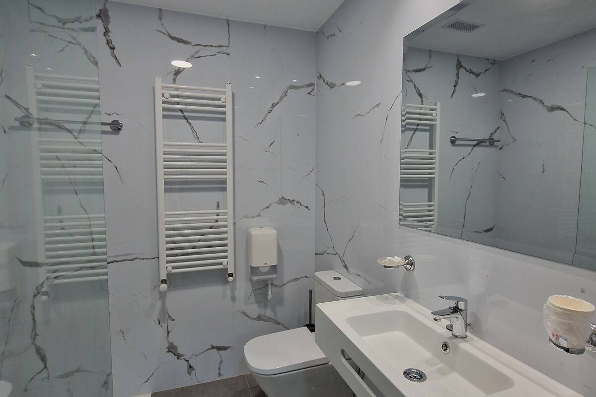 comfort room | bathroom | hair dryer, towels, soap, shampoo