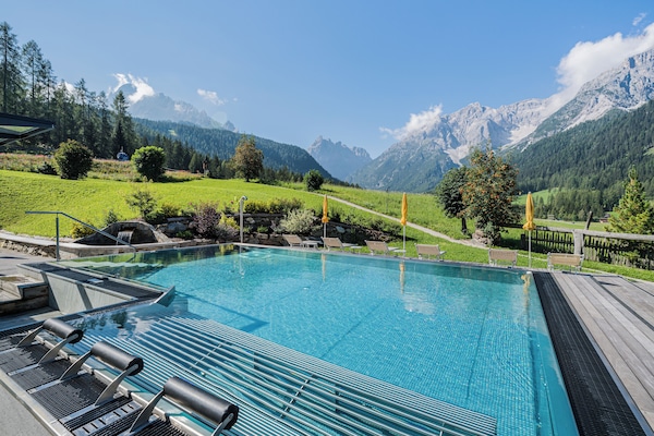 Indoor pool, outdoor pool, pool umbrellas, pool loungers