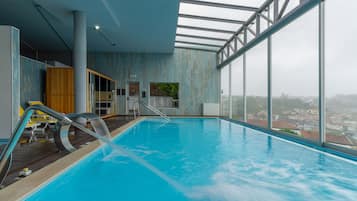 Indoor pool, open 10:00 AM to 8:00 PM, pool loungers