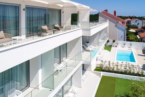 2 outdoor pools, pool umbrellas, sun loungers