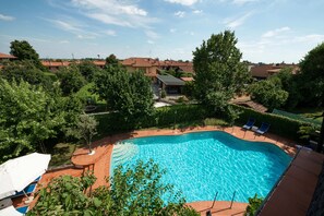 Seasonal outdoor pool, pool umbrellas, pool loungers