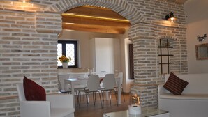 A modern living room with white furniture, a glass coffee table, and a fireplace. - I Tre Laghi Sant' Agnese - Rustic with pool, aircon (Pescara)