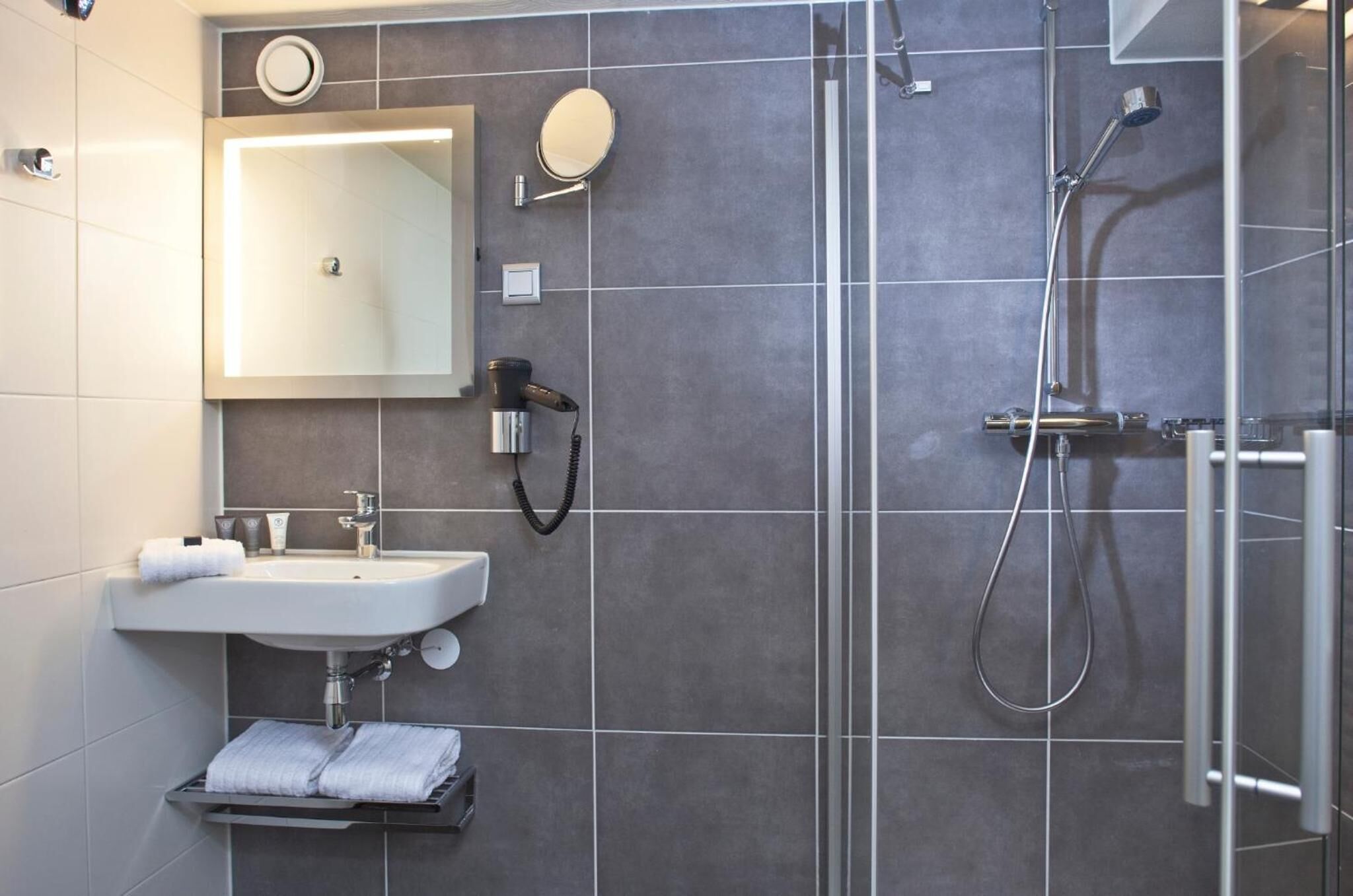 shower, eco-friendly toiletries, hair dryer, towels