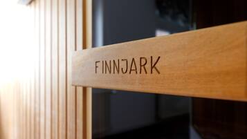 A wooden sign with the name "FINNJARK" engraved on it.