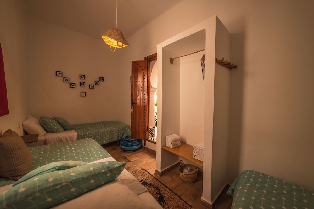 Standard Triple Room, Shared Bathroom | Rollaway beds, free WiFi, bed sheets