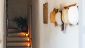 A staircase with candles and a potted plant at the top. - Seafront Villa in Bol - Prime Location  (Bol, island of Brac)