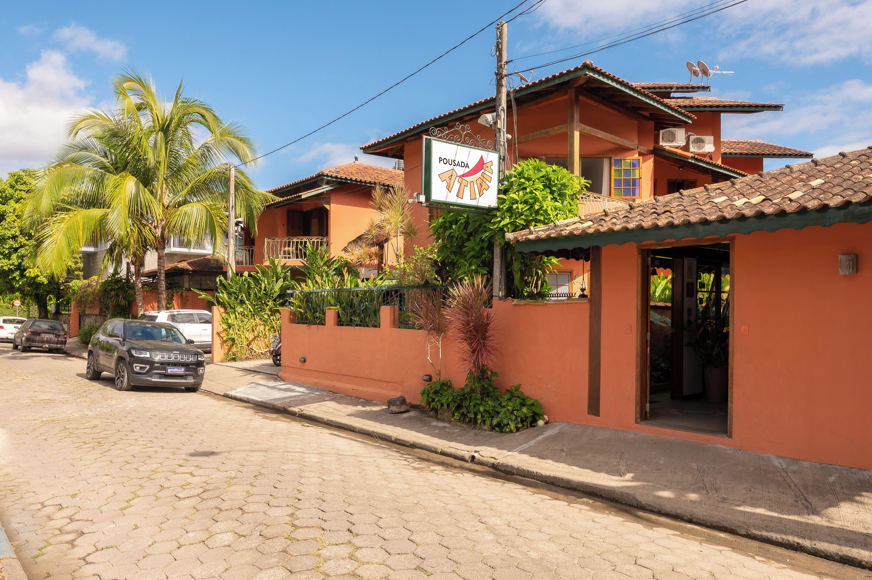 A two-story building with a sign reading "Pousada."
