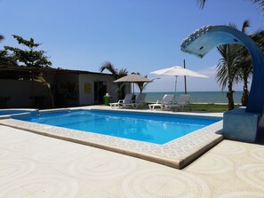 Outdoor pool, open 10:00 AM to 10:00 PM, pool umbrellas, pool loungers