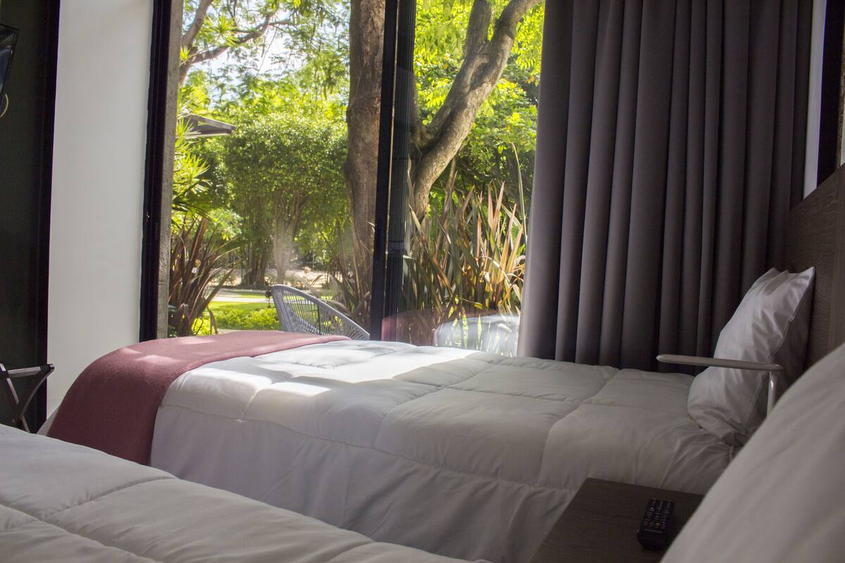 family room, 2 bedrooms, accessible, garden view | down duvets, in-room safe, individually decorated