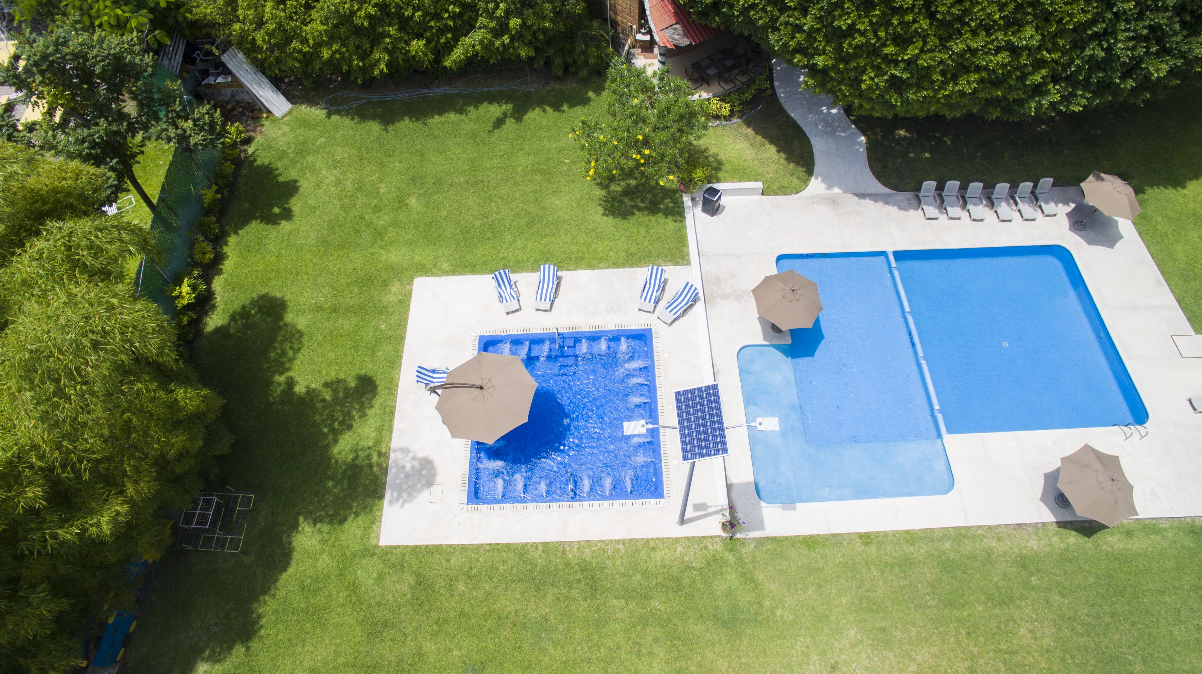 outdoor pool, pool umbrellas, pool loungers