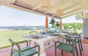 Enjoy meals al fresco with a view of the lush landscape and rolling hills.