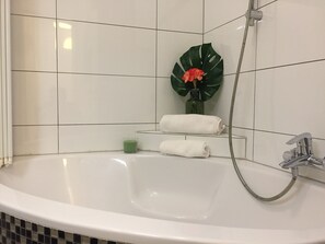 Bathtub, hair dryer, towels
