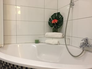 Bathtub, hair dryer, towels