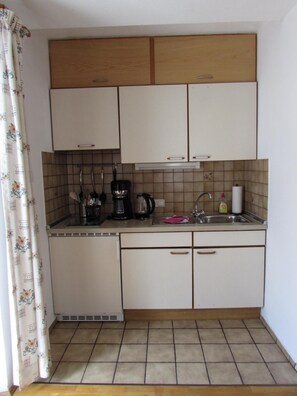 Fridge, microwave, stovetop, coffee/tea maker
