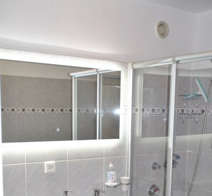 Shower, hair dryer, towels, soap