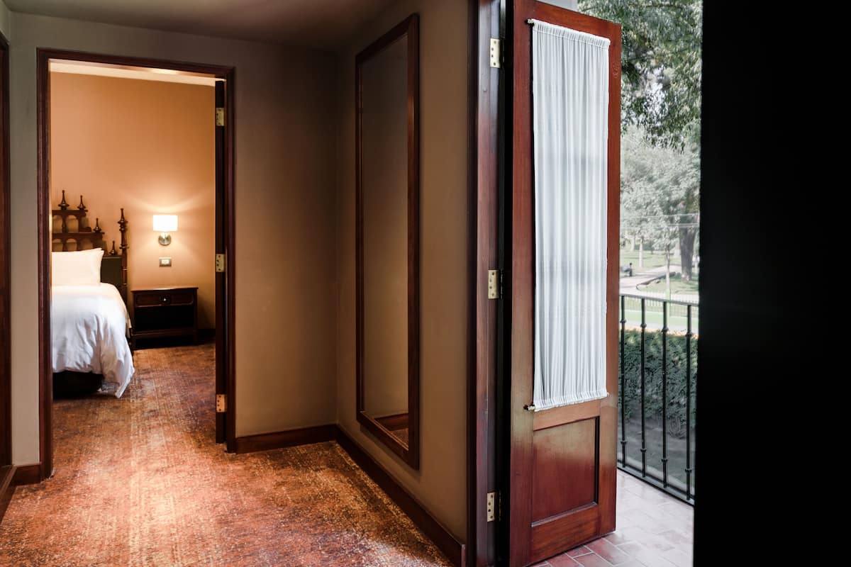 suite, 1 king bed, non smoking (colonial) | minibar, in-room safe, desk, laptop workspace