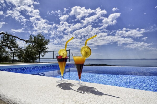 Outdoor pool, a heated pool, sun loungers