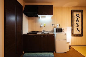 Full-sized fridge, microwave, stovetop, electric kettle