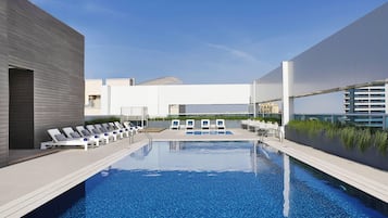 Outdoor pool, open 7:00 AM to 7:00 PM, free pool cabanas, pool umbrellas