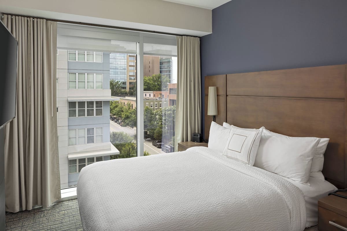 suite, 2 bedrooms, city view | in-room safe, desk, blackout curtains, iron/ironing board