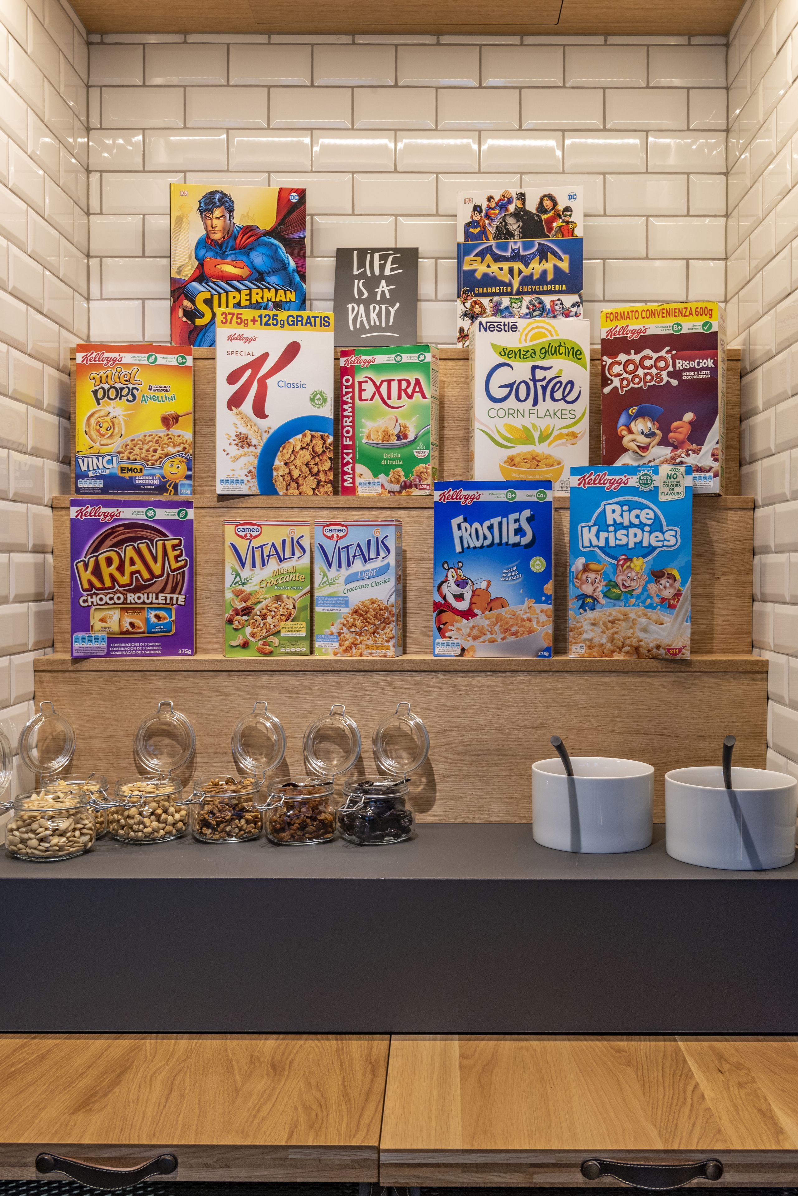 A cereal display with various brands and flavors.