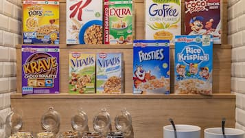 A cereal display with various brands and flavors.