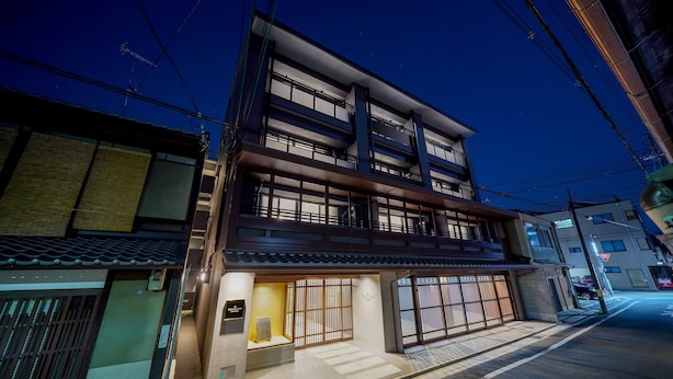 A multi-story building with a traditional entrance and a modern upper section. - RESI STAY THE KYOTO (Kyoto)