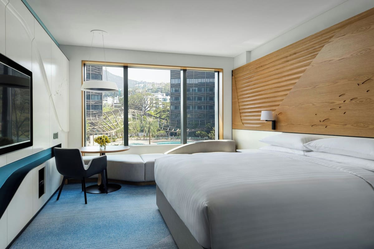 Room, 1 King Bed, Pool View | Minibar, in-room safe, desk, blackout curtains