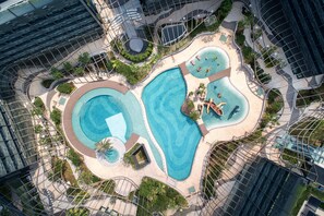 An aerial view of a resort with multiple swimming pools, landscaped areas, and modern architecture. - Hong Kong Ocean Park Marriott Hotel (Hong Kong)