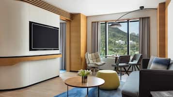 Club Suite, 1 Bedroom | Living area | 55-inch flat-screen TV with satellite channels, TV