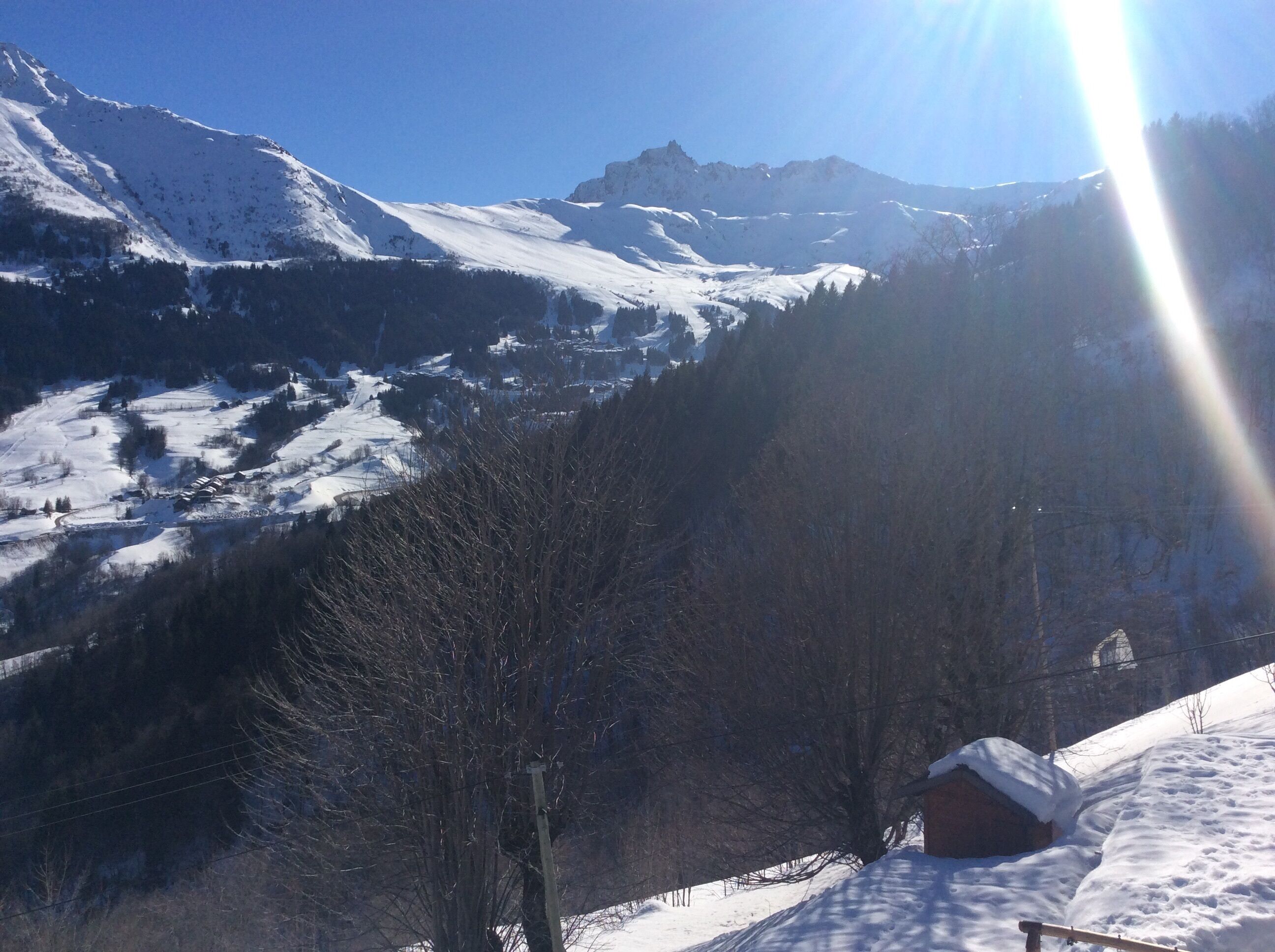 A snow-covered mountain landscape with a clear sky.