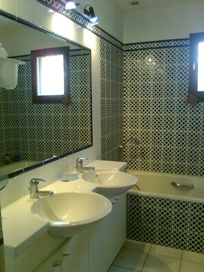 Combined shower/tub, hair dryer, towels, toilet paper